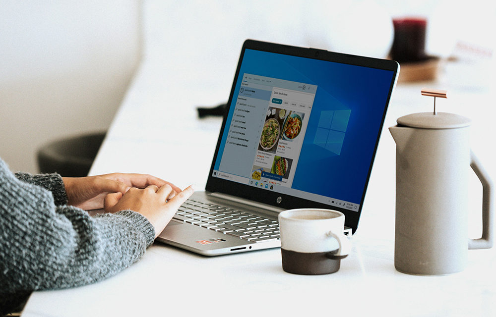 Picture of a hand typing on a laptop