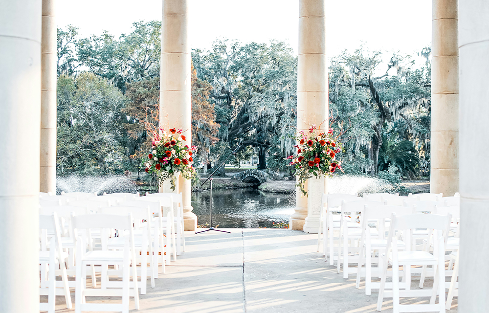 An elegant wedding set up in front of a lake